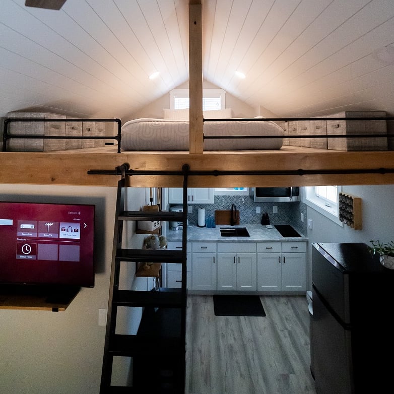 Queen size loft sleeping above kitchenette.