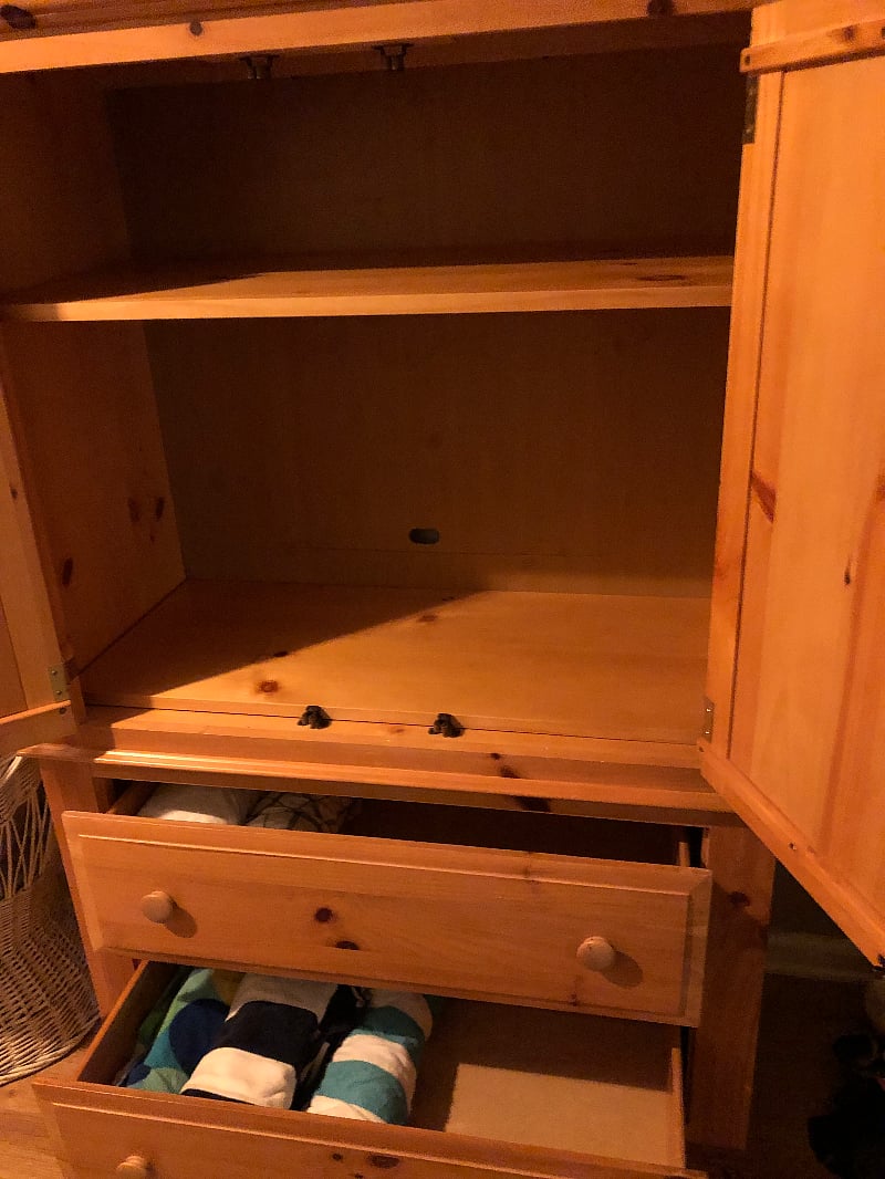 armoire storage in bedroom