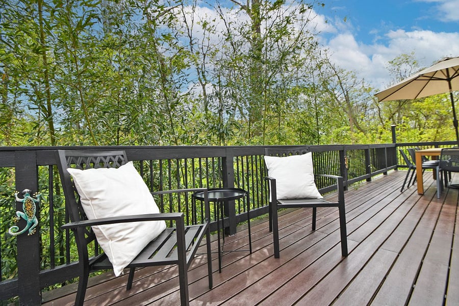 Large outdoor deck overlooking the woods.