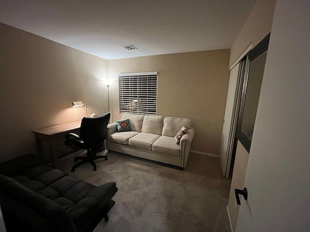 office room with a couch and futon bed