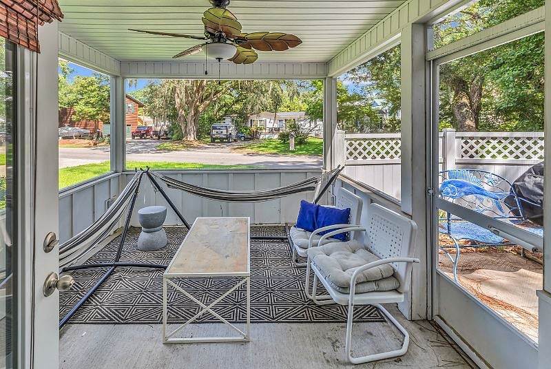 Screened in Carolina Room is the perfect place to relax and enjoy a cup of coffee or a glass of wine.