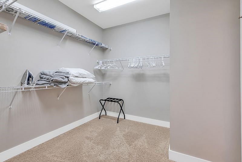 Upstairs primary bedroom attached walk in closet 