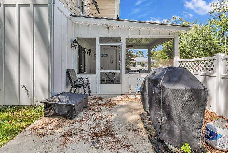Backyard has patio with propane grill and fire pit.