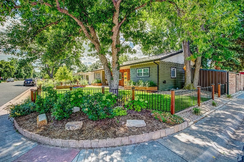 Mature trees, gardens and beautiful lawn.
