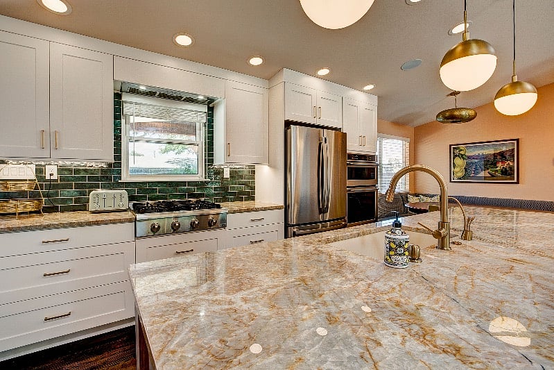 Gorgeous natural stone countertops, full size refrigerator, gas stoves, large food pantry
