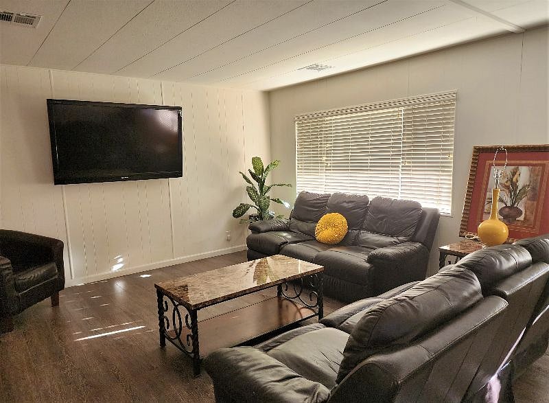 Spacious living room with 65 inch TV