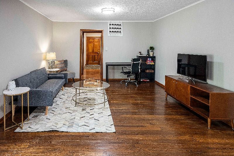 Family room/game room with futon and 43" smart TV