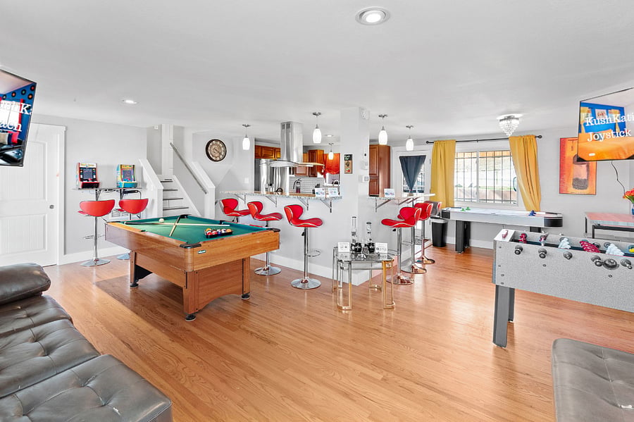 Entertainment Haven: Living Room Bliss with Pool Table, 50' Roku TV, and Arcade Games!