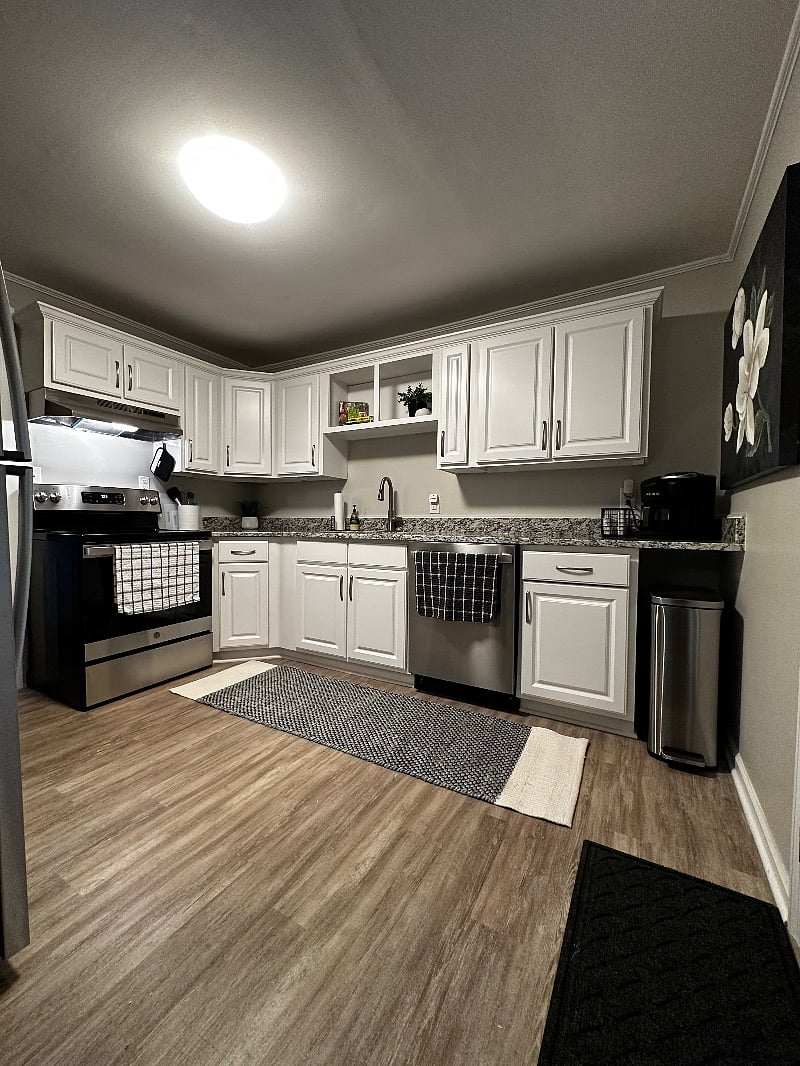 Kitchen with full set of pots, pans, cutting boards, crock pot, toaster, coffee maker, microwave and more