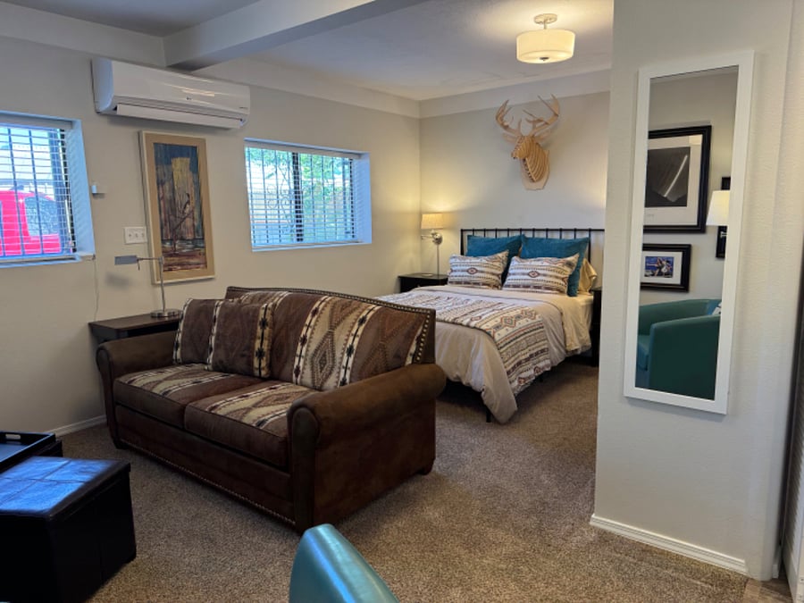 Queen bed and living area.