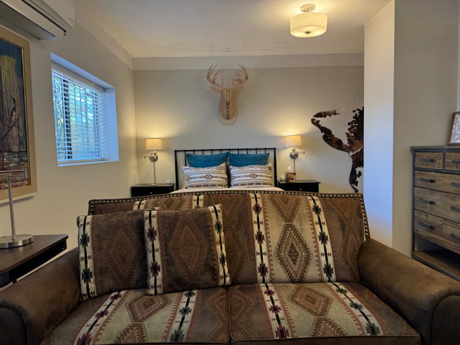Queen bed and living area.