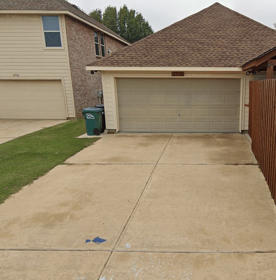 2-car garage in rear w/ a large driveway.
