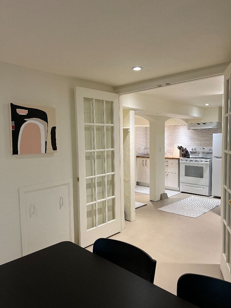 view of kitchen from dining room - new appliances & fully stocked for cooking & serving