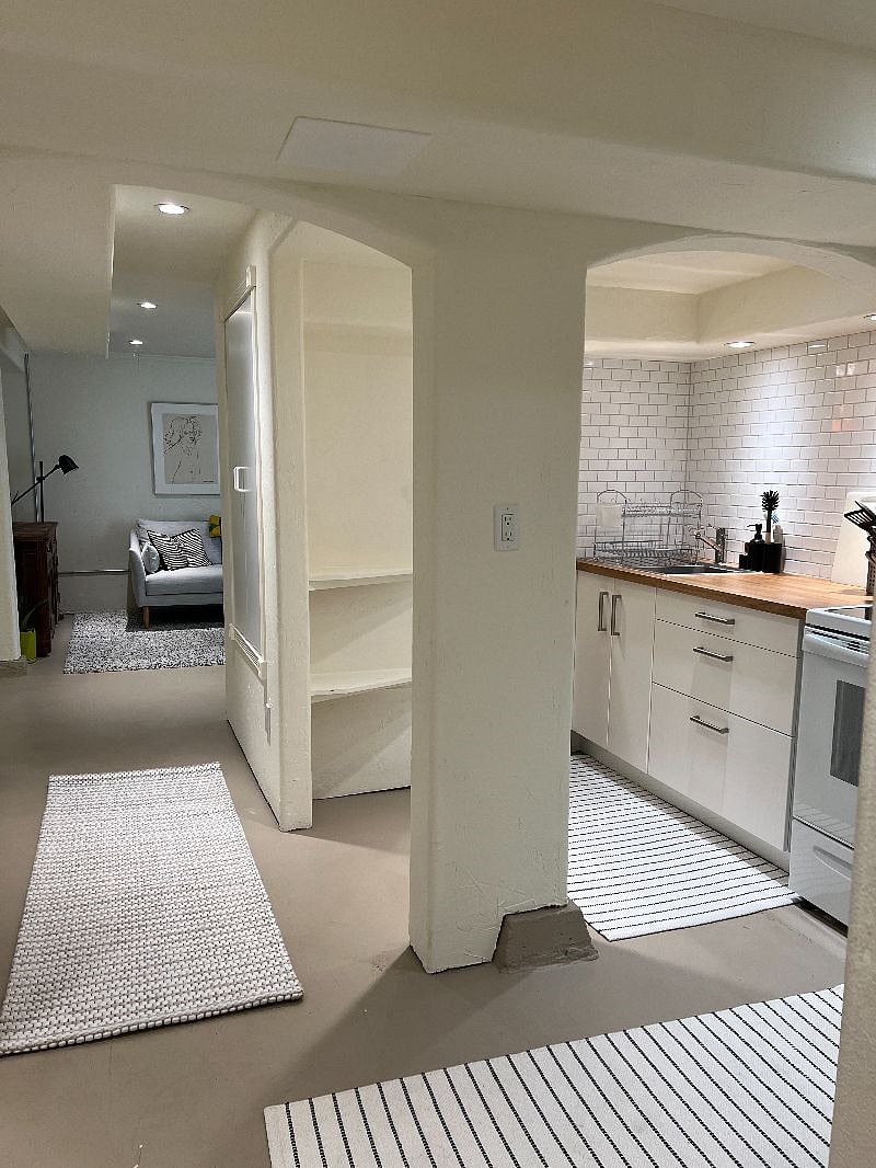 view of kitchen with hallway closet storage to living room
