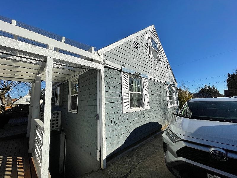 private entrance to apartment unit via driveway with covered entrance