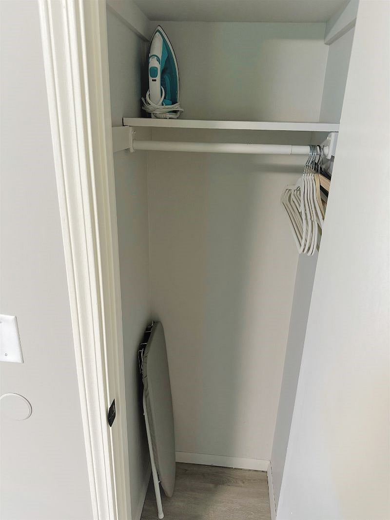 Front closet:ironing board and iron