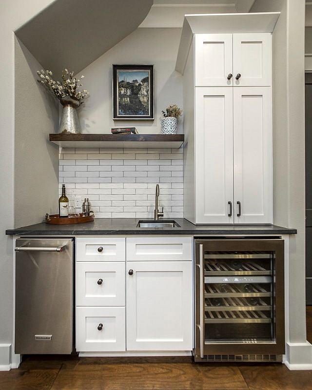 Wet bar with wine storage off kitchen