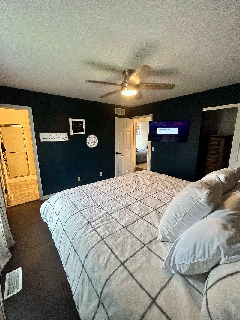 swivel mount tv to watch from the comfort of bed in the primary bedroom