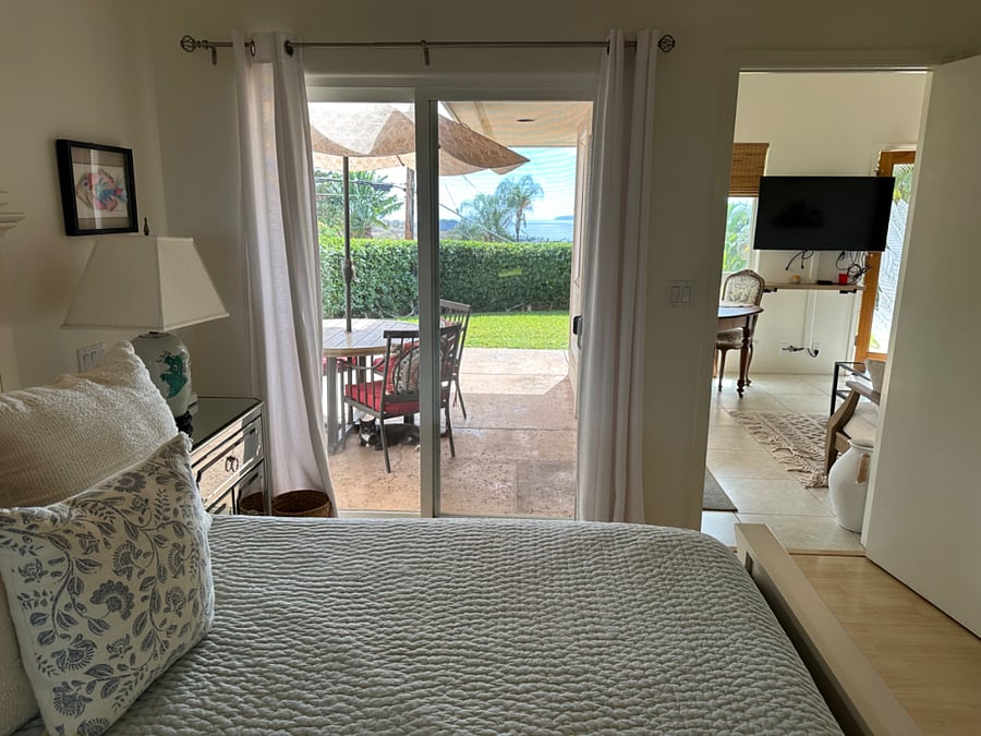 queen bed with front patio view of islands