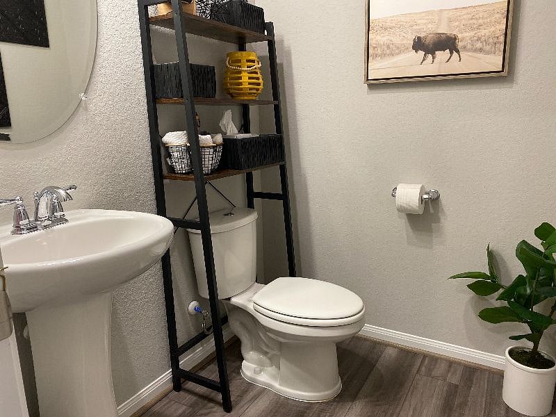 Half-bath adjacent to Primary bedroom