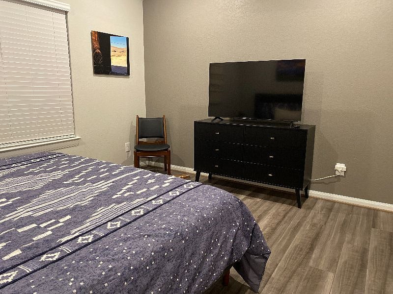 Primary bedroom with Roku TV