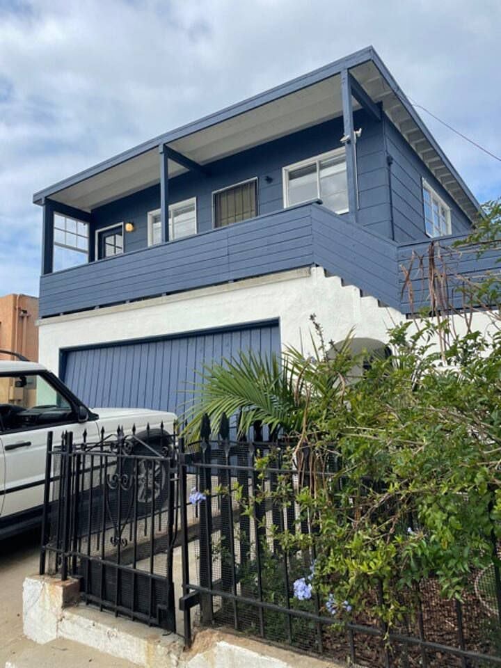 Upstairs unitl has a front porch / deck to hang out and watch the world walk by.
