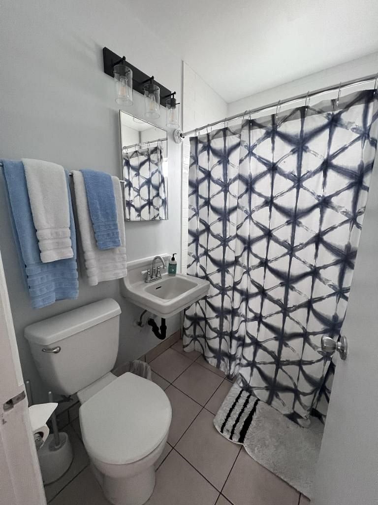 Bathroom with a full tub and shower.