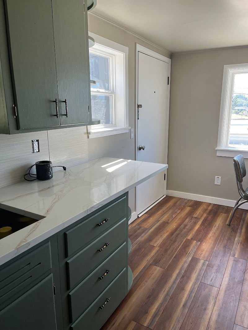 Kitchen-exterior door shown to the deck and parking lot. There are two exterior entrances, see hallway picture