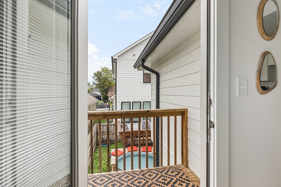 Apartment is a separate dwelling above the garage, behind the main house