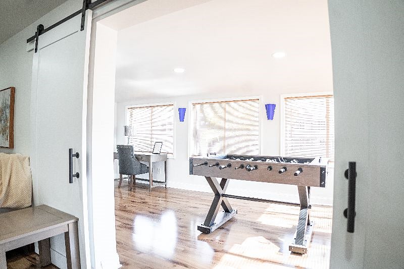 Farm doors entering office and game room