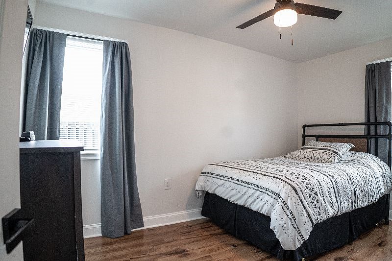 Full size bedroom with darkening curtains and Smart TV