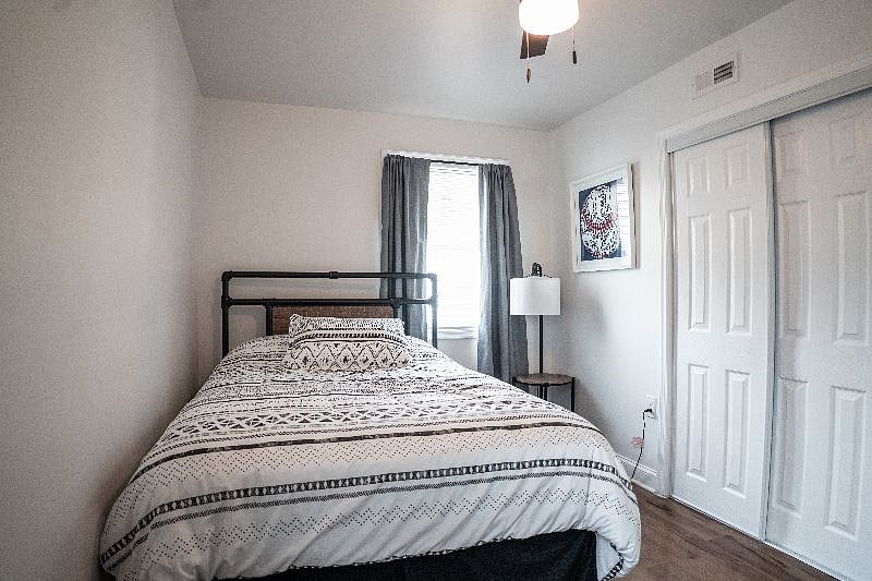 Full size bedroom with darkening curtains and Smart TV