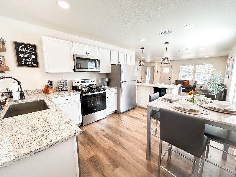 New Stainless Steel Appliances
New Granite Countertops
New Wine Cooler
New Oversized Sink
New Dining Table