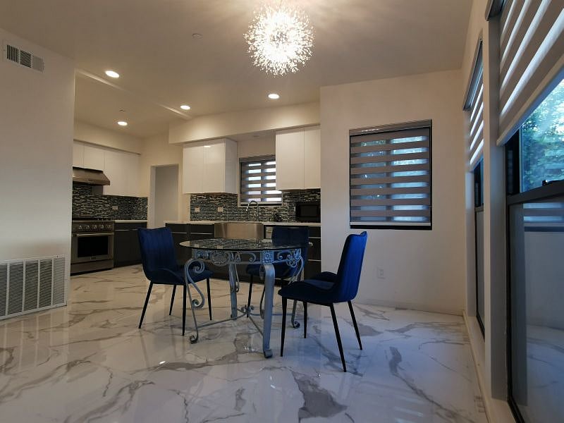 A very good size dinning room with chairs and table, large windows will provide good natural lights and comfortable. 