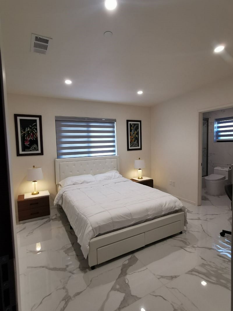 master bedroom is large, it has a queen size bed, table, chair, and nightstand lamps with USB plug for phone chargers, Built-in closet, master bath is within, and the Wi-Fi signal is excellent inside this bedroom.
