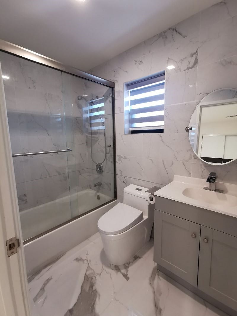 Inside master bed there is a full size bathroom with tub/shower, porcelain tiles are installed up to ceilings,  porcelain tiles are installed throughout the floor. Shampoo,  body soap and towels are provided. 