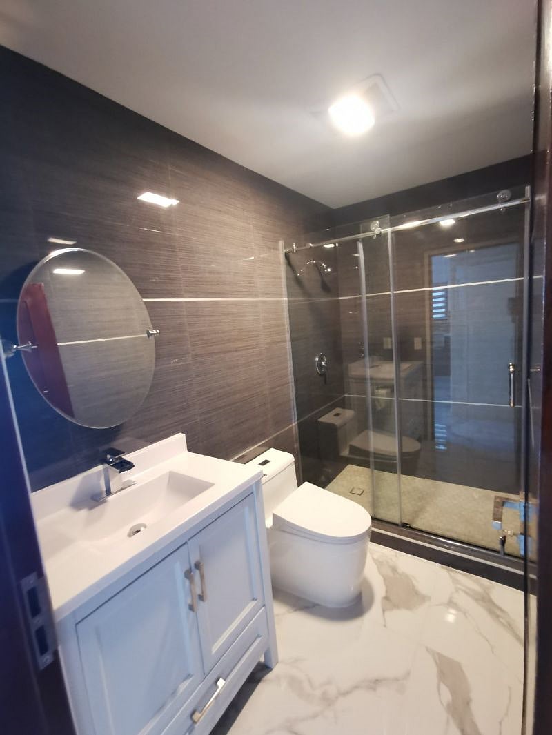 At the hall way there is a full size bathroom with large shower porcelain tiles are up to ceilings,  porcelain tiles are installed throughout the floor. Shampoo,  body soap and towels are provided. 
