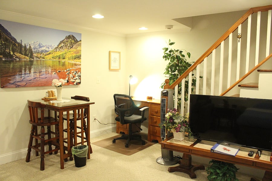 A dining set for two and a dedicated work space in the main room.