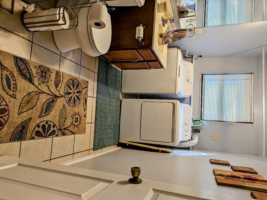 1/2 Bath shared with the Laundry room located on the lower level. 