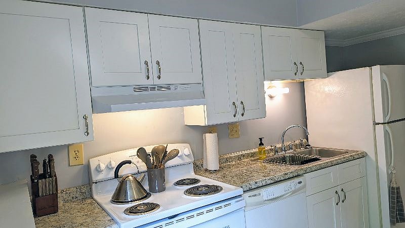 Brand New Stove, (with lots of pots and pans), New Counter top, sink and Faucet.