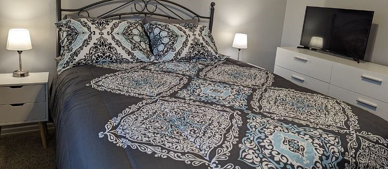Master Bedroom with Blackout Curtains and a Smart TV.