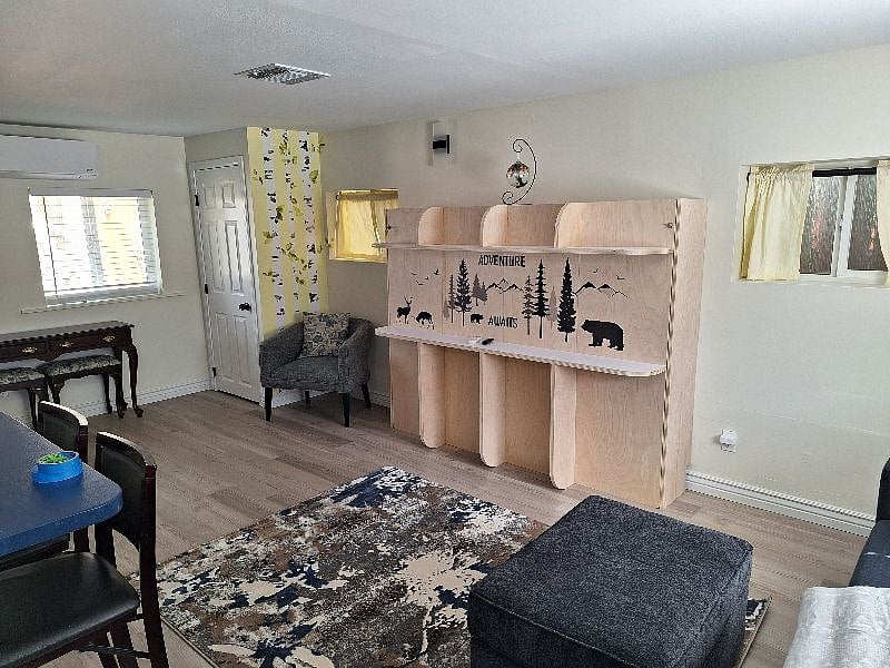Space Saving Murphy style bed with easy lift mechanism - Closed it provides a work space