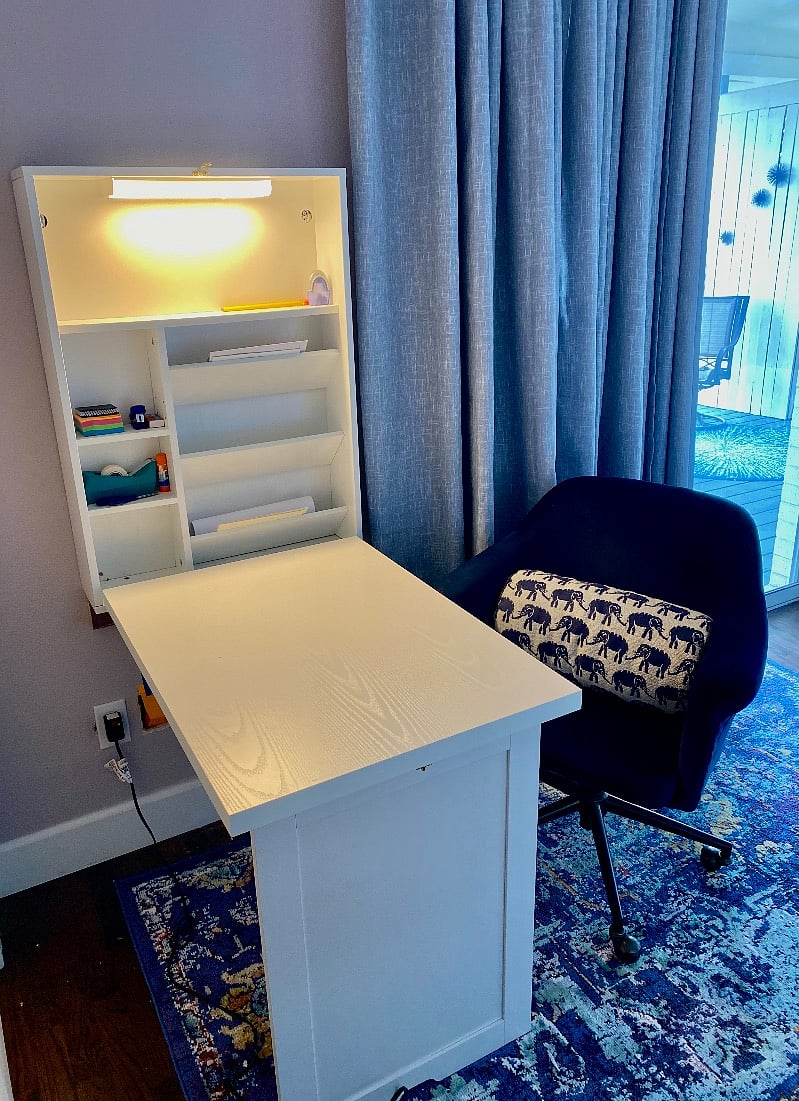 Convenient fold-down desk in bedroom for computer work, letter writing or meals in your room.