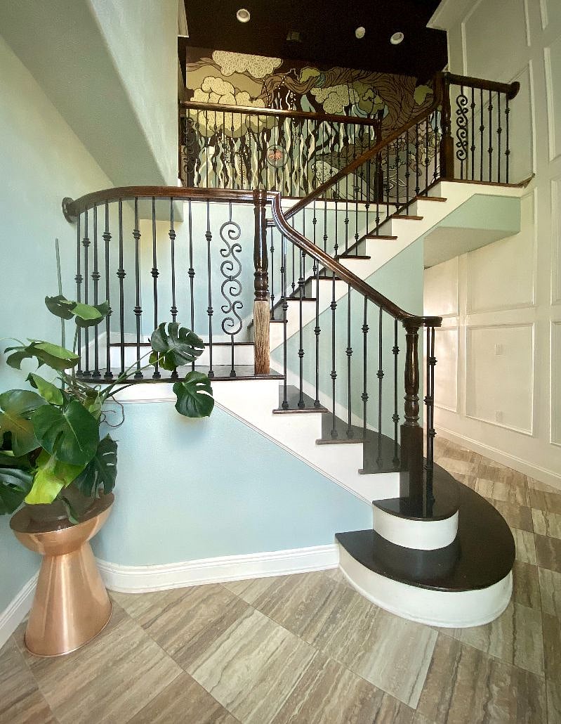 The foyer and stairs that lead up to the private rooms on the left (owner's bedroom on the right)
