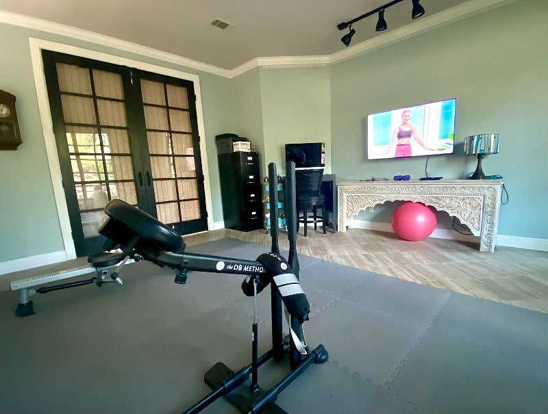 Downstairs shared "second living room" that serves as a workout room and sometimes art studio.