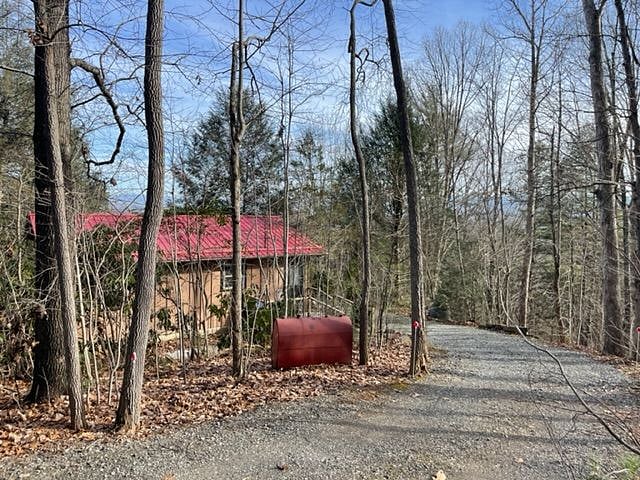 Private drive behind Cottage leads to a barn, but without any thru traffic.
