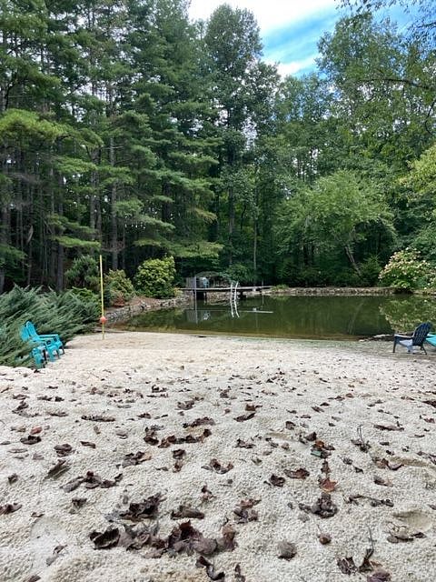 Sandy beach is a great play area for kids. Sand and swim toys provided in nearby shed.