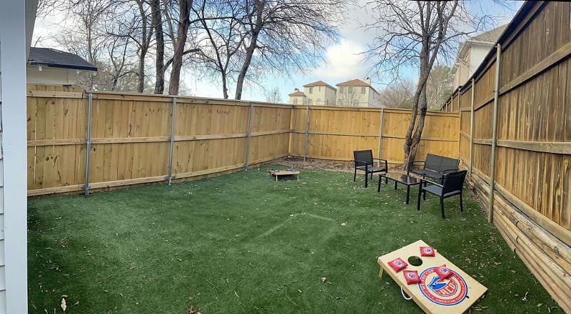 Fenced and turfed backyard area.