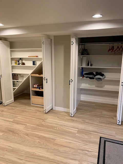 Kitchen pantry and closet with doors opened