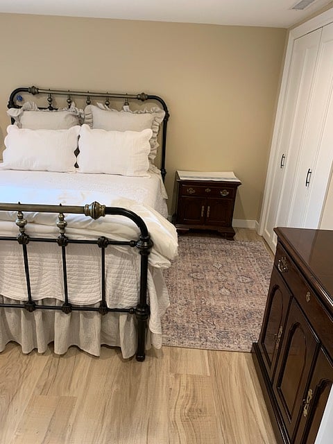 Bedroom with queen bed, closet to right side